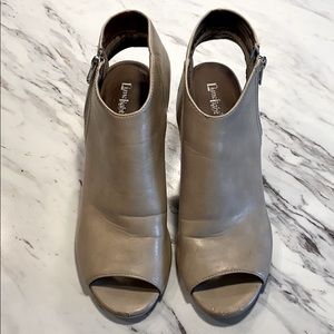 Heeled leather ankle boots with peep toe and heel